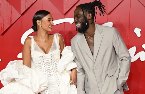 WireImage/Getty Images Maya Jama and Kojey Radical attend The Fashion Awards 2023 Presented by Pandora at the Royal Albert Hall on December 04, 2023 in London, England.