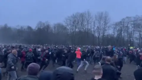 Luke Rushbrooke A crowd of people playing shrovetide football