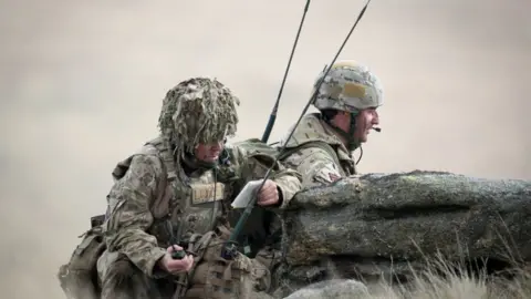 Getty Images Soldiers using radios