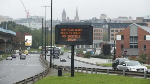 Danny Lawson/PA Wire Information board in Sheffield