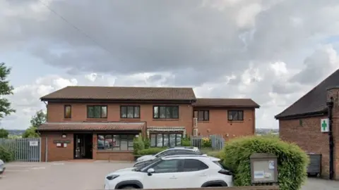 Google Brick-built, two-storey surgery in a residential street