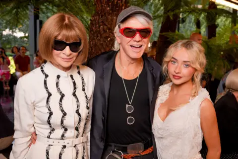 Swan Gallet/WWD via Getty Images Anna Wintour, Baz Luhrmann and Sabrina Carpenter at the Dior fashion show as part of Paris Haute Couture Fall/Winter 2026 held at Musée Rodin on July 06, 2026 in Paris, France. 