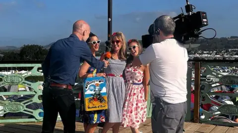 Elizabeth McGregor The Charlala's being interviewed at Glastonbury last year by a TV crew