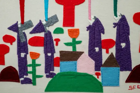 Stewart Francis Easton A colourful stitched image of four characters looking skywards. They have bursts of colour coming from their mouths.