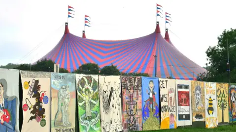 Getty Murals in front of big tent