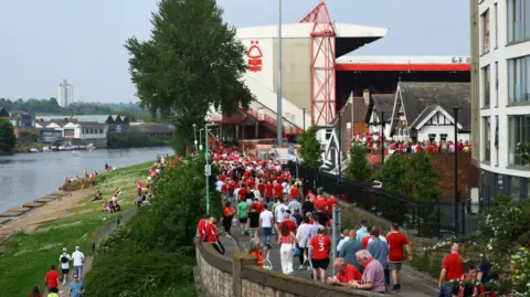 Fans walking to the City Ground in Nottingham