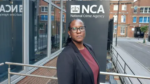 National Crime Agency Simone Alleyne is standing outside the headquarters of the National Crime Agency in London
