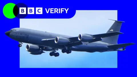 A US KC-135 in flight. It is grey and marked with the "US AIR FORCE". It is superimposed over the BBC Verify colours and logo. 
