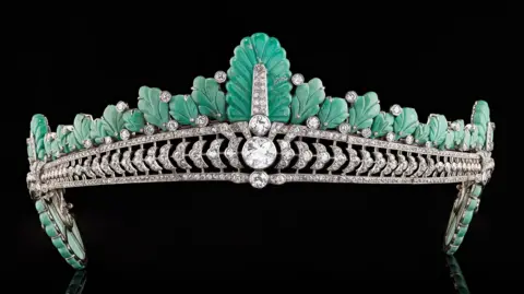 The tiara from the front showing the turquoise plumage and large diamond at the centre. 