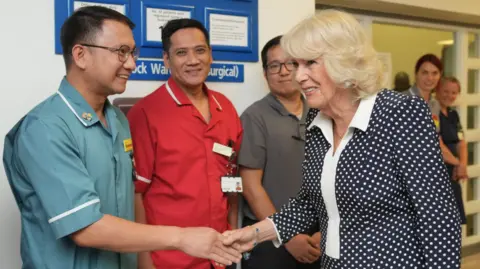PA Media Queen Camilla meets members of staff at the hospital.