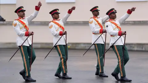 PA Media A team from Oman compete in the British Army's All Arms International Pace Sticking Competition at the Royal Military Academy Sandhurst.