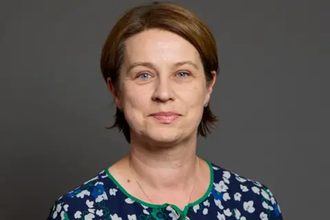 UK Parliament A woman with short brown hair. 