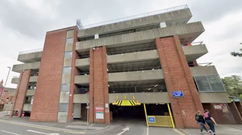 A google street view of the five-storeycar park with concrete barriers and brick walls