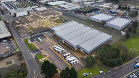 Sizewell C A drone image of the Ransomes Europark where the new bus depot could be located. Large industrial buildings can be seen as well as parking areas.