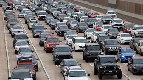 Traffic backs up on southbound Interstate 805 as people are about to enter Tijuana, Mexico at the Otay Mesa Port of Entry on May 3, 2025 in San Diego, California.