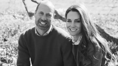 Kensington Palace A black and white photograph of Prince William (right) and his wife Kate (left)