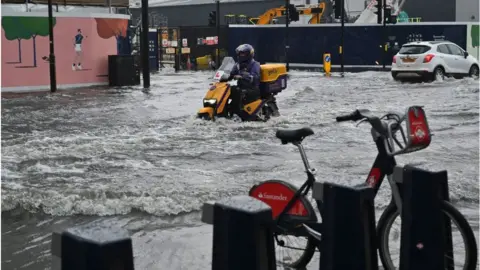 Getty Images Motorbike in flood water