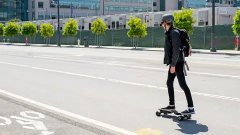 Getty Images Man on electric skateboard