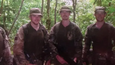 Craig Godsall Craig (right) and two other soldiers in uniform