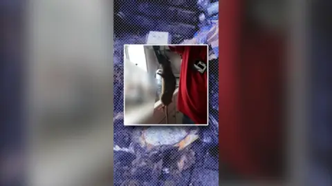 A rat is held up in an image by a trap. A background of rubbish sprawled out on the street - with a blue tint.