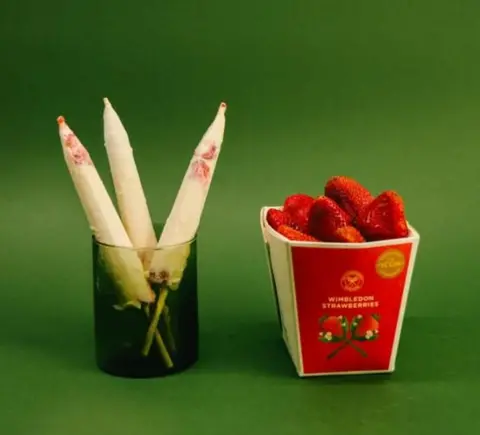 KUReMAL'S A strawberries and cream kulfi pictured alongside a carton of wimbledon strawberries in a KUReMAL'S promotional image. 
