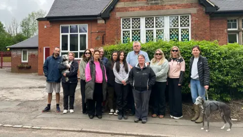 Parents outside Hutchinson Memorial CE First School 