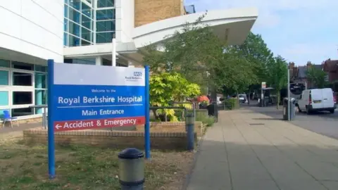 A general view outside the Royal Berkshire Hospital, with a road on the right side.