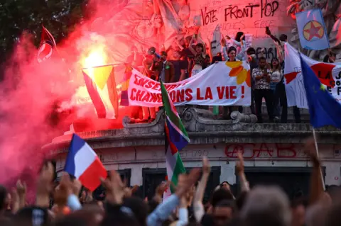 Reuters Anti-right protestors setting off flares in Paris