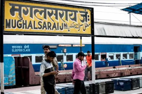 BBC People at the Mughalsarai station platform waiting for their train