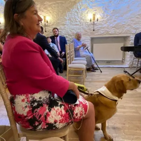 Helen McCann Helen McCann with her guide dog Poppy