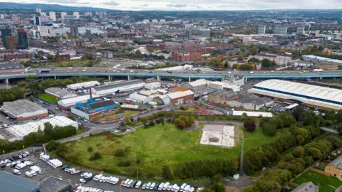 MEDIA HOUSE An aerial view of part of Glasgow, including a large, empty bit of grassy land