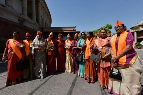 Hindustan Times via Getty Images Women BJP's Ministers and MP's leave after watching Prime Minister Narendra Modi's virtual address on the occasion of BJP Foundation day , at Parliament house library