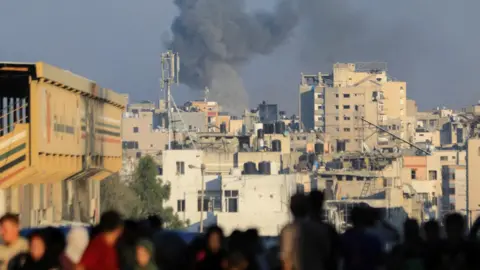 Reuters Smoke rises following an Israeli air strike in Gaza City, in the northern Gaza Strip (7 July 2024)