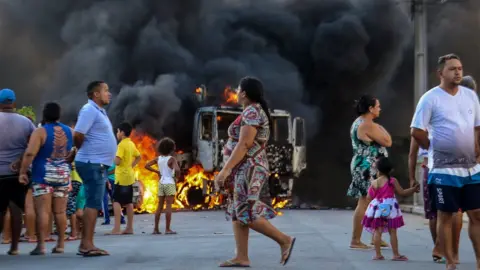 AFP PHOTO/ O POVO/ALEX GOMES Burning bus in Brazil's northern city of Fortaleza
