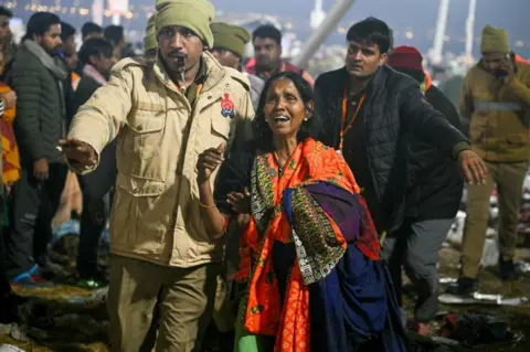 AFP A devotee weeps at the site of stampede amid the ongoing Maha Kumbh Mela festival in Prayagraj on January 29, 2025. 