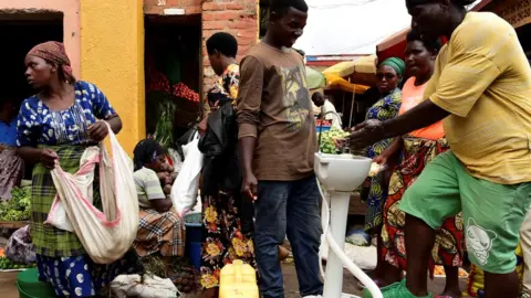 Reuters public handwashing station at a bus station in Kigali