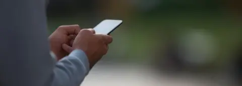 Getty Images Man on phone