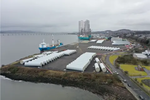 Drone image of wind farm components stacked on the quayside at Dundee Harbour