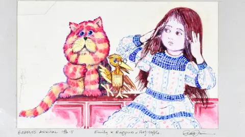 A brightly coloured Peter Firmin illustration showing Bagpuss sitting on a pink cabinet beside Emily, who is wearing a long patterned dress with blue trim. Professor Yaffle perches between them. Bagpuss is painted in pink and orange stripes against a pale background.