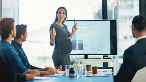 Getty Images Expectant mother in the workplace
