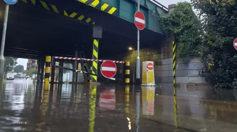 BBC Weather Watchers/Amil808 Flood water under a bridge