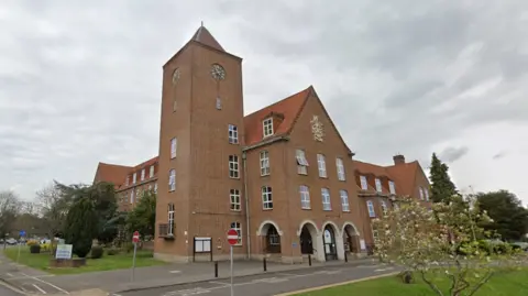 Google A Google Street image of the council's red-bricked offices with a clock tower.