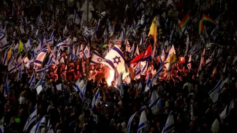 Reuters Israelis demonstrate after Israeli Prime Minister Benjamin Netanyahu sacked his defense minister, Yoav Gallant, citing lack of trust, in Tel Aviv, Israel November 5, 2024