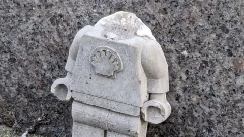 Shell Lego design that has lost its head