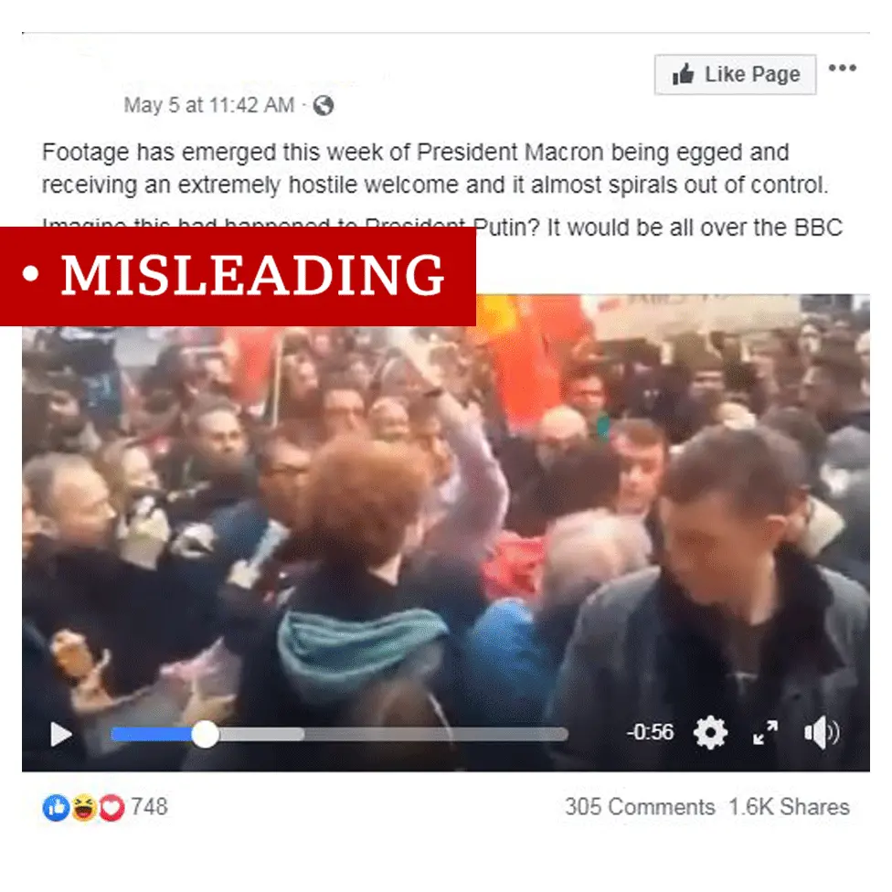 Screenshot of video showing Emmanuel Macron getting egged. Video labelled "misleading"