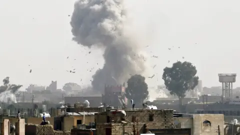 EPA Smoke rises from Sanaa, Yemen, after reported air strike by Saudi-led coalition (31 August 2016)