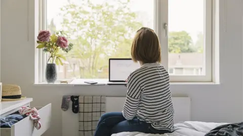 Getty Images A woman working at home