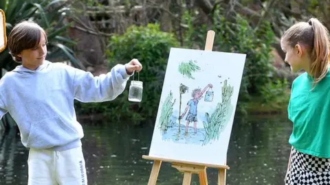 Children looking at a famous piece of Quentin Blake art