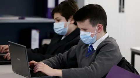 Reuters Children wearing school masks