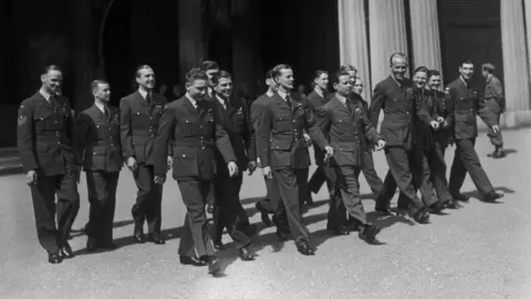 Getty Images Wing Cdr Guy Gibson and members of his squadron at Buckingham Palace